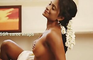 Indian latitudinarian topless in saree